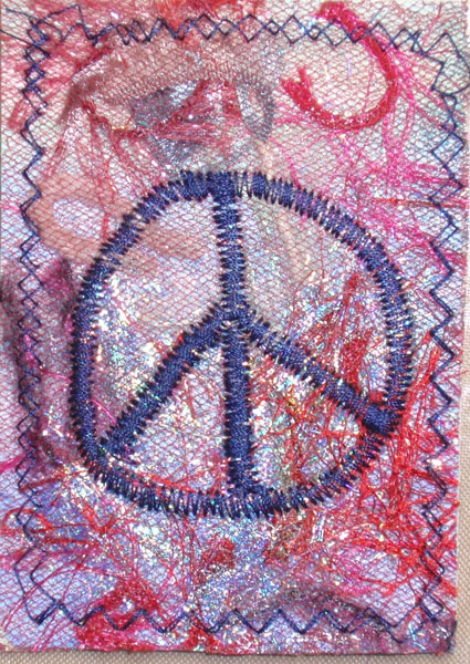 fused fibers, embossing powder, thread<br />free sew the peace symbol